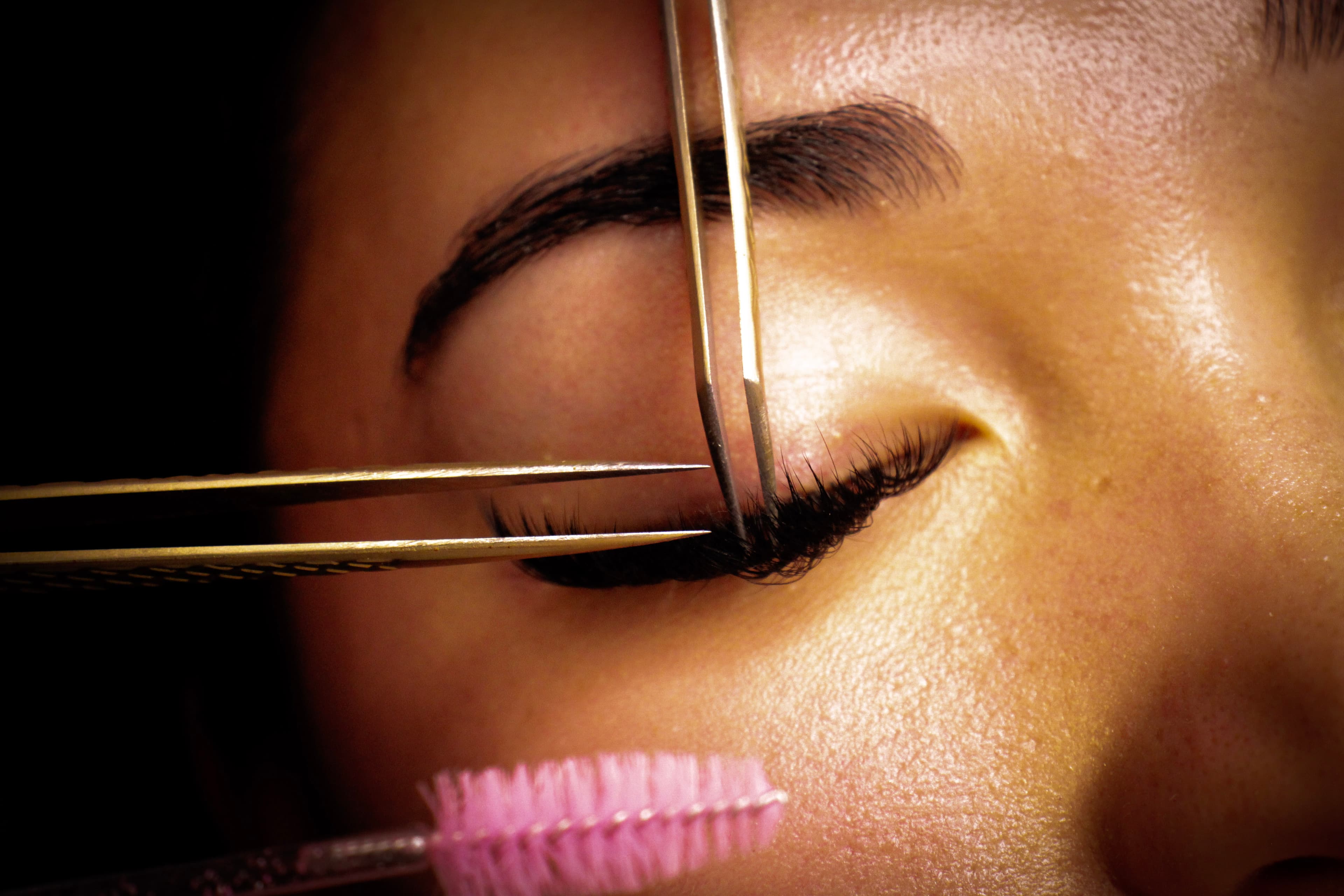 Individual lash extensions being applied